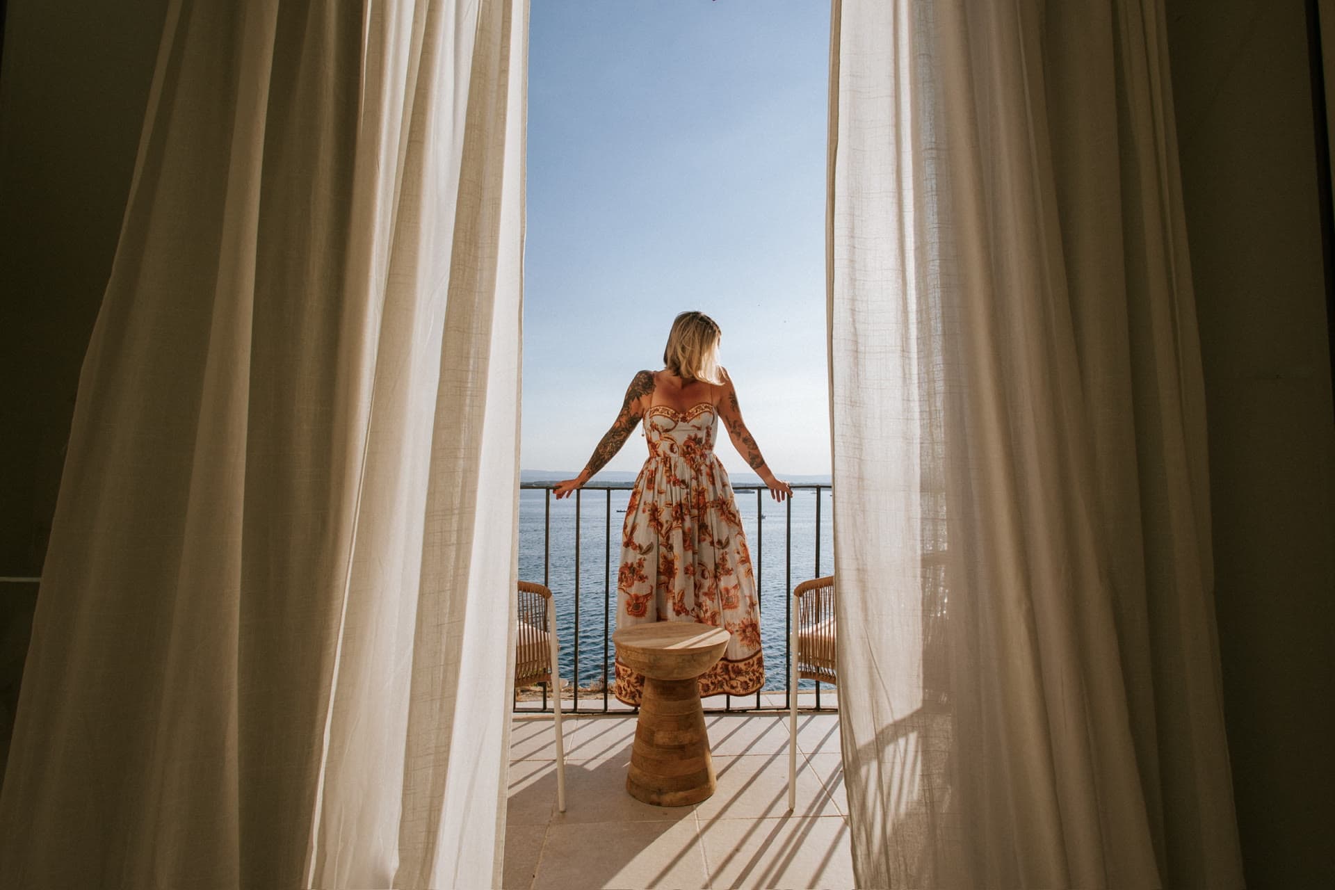 Curtains framing the Lula Mare balcony over the Mediterranean